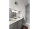 Stylish bathroom features dual sinks with a large vanity mirror and a glass-enclosed tiled shower area at 34 Dereef Ct, Charleston, SC 29403