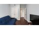 Bedroom featuring a futon, television, double doors, and light gray walls at 34 Dereef Ct, Charleston, SC 29403
