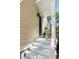 Inviting front porch with white railing, rocking chairs, and a view of the landscaped yard at 34 Dereef Ct, Charleston, SC 29403
