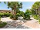 Beautiful garden area featuring lush landscaping, brick pathways, and seating, perfect for relaxation and enjoyment at 34 Dereef Ct, Charleston, SC 29403