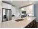 Bright kitchen with white cabinets, stainless steel appliances, and a large island with seating at 34 Dereef Ct, Charleston, SC 29403