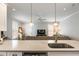 Modern kitchen featuring a breakfast bar that opens to a living room with beautiful natural light at 34 Dereef Ct, Charleston, SC 29403