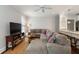 Spacious living room showcasing a sectional sofa, modern decor, and seamless flow into the kitchen at 34 Dereef Ct, Charleston, SC 29403