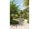 Scenic park area with a decorative water fountain, lush greenery, and palm trees, creating a tranquil atmosphere at 34 Dereef Ct, Charleston, SC 29403