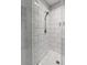 Tiled shower with glass door, rainfall showerhead, and built-in niche, offering a luxurious bathing experience at 34 Dereef Ct, Charleston, SC 29403