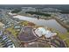 Community aerial view featuring a pool, sports courts, parking, lake and surrounding neighborhood at 410 Eliston St, Summerville, SC 29486
