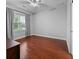 Bedroom with hardwood floors, window with blinds, and a ceiling fan at 410 Eliston St, Summerville, SC 29486