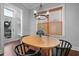 Breakfast area features modern light fixture, wooden table, and natural light at 410 Eliston St, Summerville, SC 29486