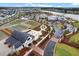 Overhead shot of the clubhouse, community garden, and recreational facilities, surrounded by homes and landscaping at 410 Eliston St, Summerville, SC 29486
