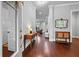 Elegant foyer featuring hardwood floors, neutral walls, and stylish console table, leading to the living area at 410 Eliston St, Summerville, SC 29486