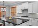 Bright kitchen boasts granite counters, stainless steel appliances, and ample storage space at 410 Eliston St, Summerville, SC 29486