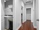 Bright laundry room featuring modern appliances and ample storage space with shelving above at 410 Eliston St, Summerville, SC 29486