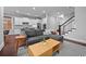 Open-concept living space with modern furnishings, seamless flow to the kitchen, and a staircase at 410 Eliston St, Summerville, SC 29486