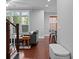 Open-concept living room featuring hardwood floors, neutral walls, and a staircase at 410 Eliston St, Summerville, SC 29486