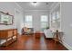 Cozy living room with hardwood floors, and neutral walls with a large window at 410 Eliston St, Summerville, SC 29486