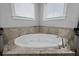 Soaking tub with tile surround and chrome faucet at 410 Eliston St, Summerville, SC 29486