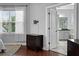 Bright main bedroom with a window, TV mount and ensuite bathroom at 410 Eliston St, Summerville, SC 29486