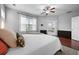 Comfortable main bedroom features a ceiling fan and access to an ensuite bathroom with a large soaking tub at 410 Eliston St, Summerville, SC 29486