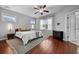 Bright main bedroom with hardwood floors, a ceiling fan, and lots of natural light at 410 Eliston St, Summerville, SC 29486
