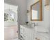 Bright bathroom boasts a white vanity with marble countertop and modern fixtures at 507 Mccants Dr, Mount Pleasant, SC 29464