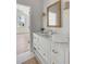 Bright bathroom boasts a white vanity with marble countertop and modern fixtures at 507 Mccants Dr, Mount Pleasant, SC 29464