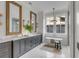 Elegant bathroom with double vanities, marble countertops, a soaking tub, and natural light creating a luxurious, spa-like experience at 507 Mccants Dr, Mount Pleasant, SC 29464