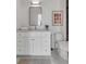 Bathroom featuring vanity with marble countertop, modern fixtures, and decorative artwork at 507 Mccants Dr, Mount Pleasant, SC 29464