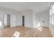 Bedroom featuring hardwood floors, white walls, and multiple doors at 507 Mccants Dr, Mount Pleasant, SC 29464