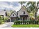 Charming two-story brick home with a well-manicured lawn and a driveway leading to an attached garage at 507 Mccants Dr, Mount Pleasant, SC 29464