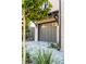 Home exterior with a grey garage door, brick accents, and manicured landscaping at 507 Mccants Dr, Mount Pleasant, SC 29464