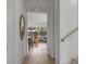 Hallway featuring hardwood floors, and entry to an open concept living and dining area at 507 Mccants Dr, Mount Pleasant, SC 29464