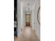 Bright hallway features wood floors, white trim, and a glass paneled front door for plenty of natural light at 507 Mccants Dr, Mount Pleasant, SC 29464