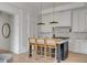 Bright, modern kitchen with marble countertops, a center island with seating, and sleek, white cabinetry at 507 Mccants Dr, Mount Pleasant, SC 29464
