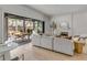 Bright living room featuring a sliding glass door to an outdoor patio and a cozy fireplace at 507 Mccants Dr, Mount Pleasant, SC 29464