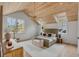 Comfortable main bedroom with wood plank ceiling, natural light, and stylish decor adding a warm ambiance at 507 Mccants Dr, Mount Pleasant, SC 29464