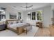Bright and spacious main bedroom with natural light, a cozy bench, and elegant décor create a welcoming and serene atmosphere at 507 Mccants Dr, Mount Pleasant, SC 29464