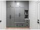 Mudroom boasts gray cabinets, drawers, and shelving for organized storage creating a functional space at 507 Mccants Dr, Mount Pleasant, SC 29464