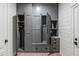 Well-organized mudroom features gray built-in cabinets, drawers, and shelving providing ample storage at 507 Mccants Dr, Mount Pleasant, SC 29464