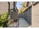 Private outdoor shower with wood accents and stone pathway, perfect for rinsing off after a swim at 507 Mccants Dr, Mount Pleasant, SC 29464