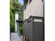 Backyard with a pathway leading to an outdoor shower, offering a refreshing space at 507 Mccants Dr, Mount Pleasant, SC 29464