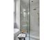 Modern glass enclosed shower with subway tile and mosaic tile floor, featuring rainfall shower head and handheld sprayer at 507 Mccants Dr, Mount Pleasant, SC 29464
