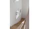 Bright stairway with natural light, featuring hardwood steps and white trim at 507 Mccants Dr, Mount Pleasant, SC 29464