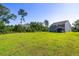 Expansive backyard with lush green grass and privacy provided by mature trees at 5115 Cranesbill Way, Johns Island, SC 29455