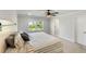 Well-lit bedroom with modern ceiling fan and a view at 5115 Cranesbill Way, Johns Island, SC 29455