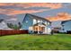 Spacious backyard featuring a screened porch, outdoor seating area, and lush lawn at 5525 Alpine Dr, Summerville, SC 29483