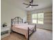 This bedroom includes ceiling fan, iron bed frame, and built in shelving at 5525 Alpine Dr, Summerville, SC 29483