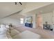 Spacious bonus room features a vaulted ceiling, a comfortable couch, and a large screen television at 5525 Alpine Dr, Summerville, SC 29483