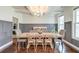 Elegant dining room with coffered ceilings, a wooden table, and stylish seating at 5525 Alpine Dr, Summerville, SC 29483