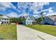 A charming blue two-story house with lush landscaping and a spacious lawn at 5525 Alpine Dr, Summerville, SC 29483
