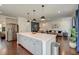 Modern kitchen boasts an island, stainless appliances, and seamless connectivity with the living area at 5525 Alpine Dr, Summerville, SC 29483